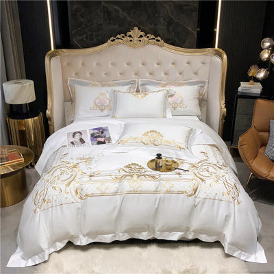 Parure de lit en coton égyptien blanc avec broderie dorée sur lit Queen