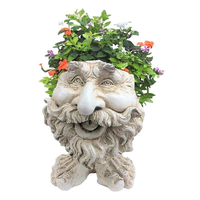 Cache-pot visage en résine jaune avec plante verte