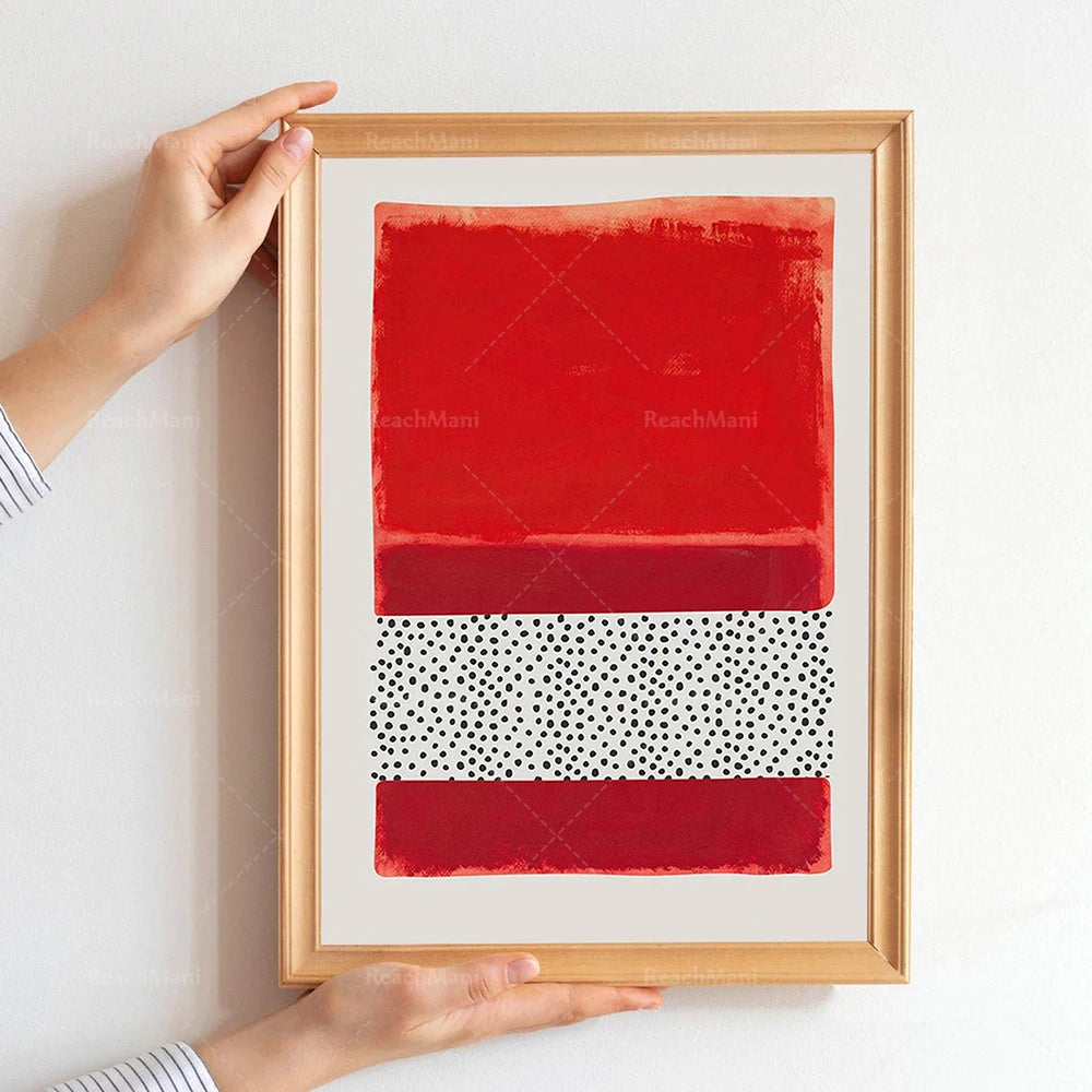 Une œuvre d'art contemporaine abstraite avec des motifs géométriques rouges et noirs dans un cadre en bois.