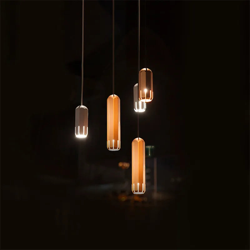 lampe suspendue or rose moderne facettes géométriques câble noir chambre salon