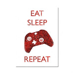 Phrase d'alt texte : Un manette de jeu rouge, avec le texte "Manger, dormir, répéter" écrit au-dessus.