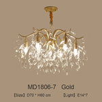 lustre moderne cristal K9 doré noir ampoules LED branches stylisées transparentes salon mariage
