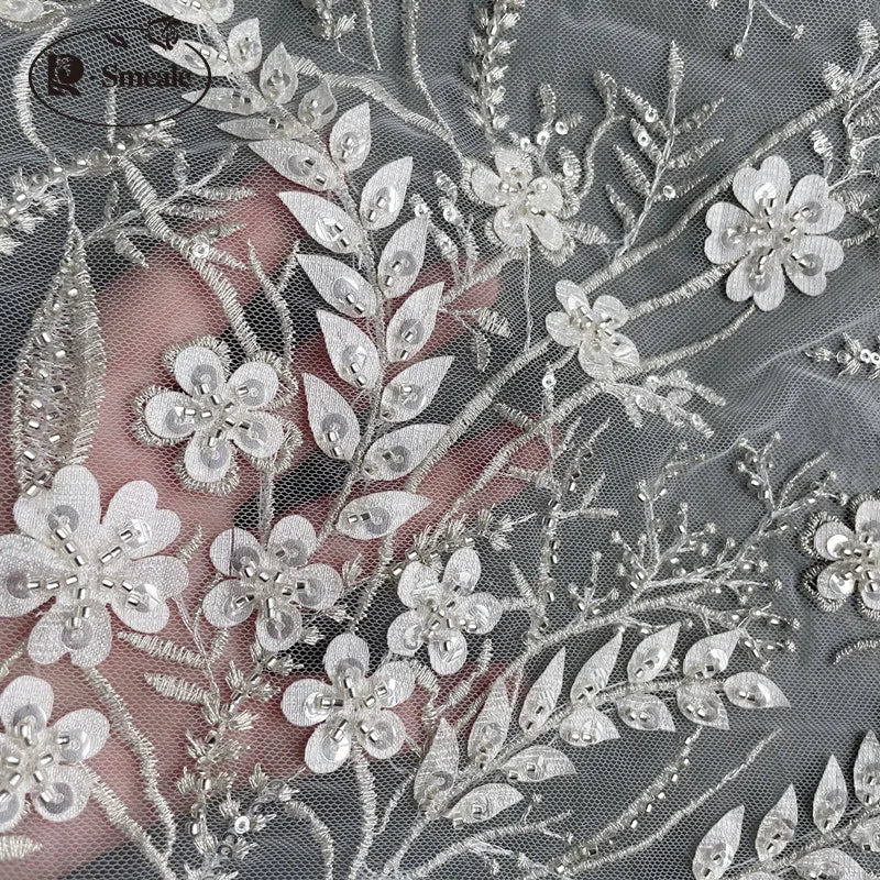 tissu dentelle transparent broderies fleurs brillantes élégant romantique création couture polyester