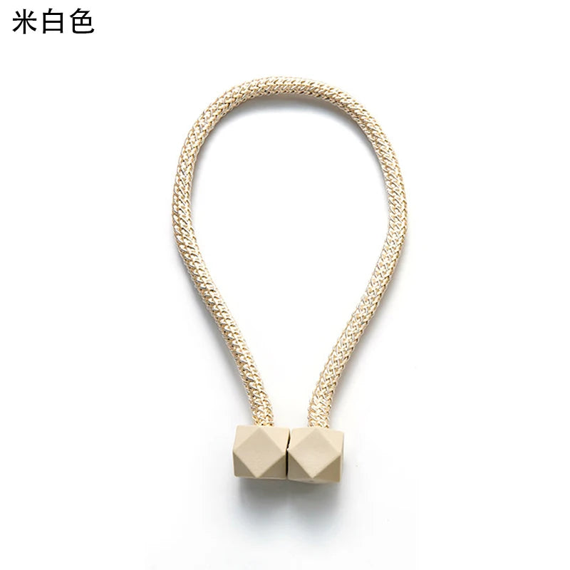 attaches rideaux décoratives modernes couleurs vives tressure cordée forme cube prismatique fixations nodales