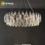 chandelier moderne luxueux transparent feuilles stylisées câbles métalliques doré argenté