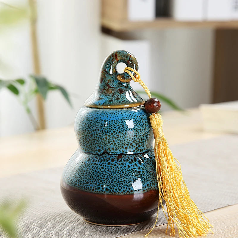 pot thé céramique vert brun artisanal couvercle anneaux pompon décoration maison stockage épices