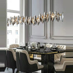 Suspension lumineuse contemporaine transparente dorée cristaux géométriques chambre salon