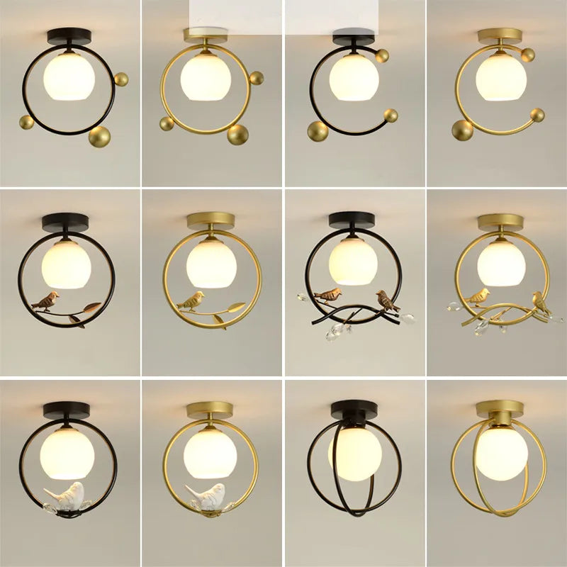 lampe moderne or noir oiseaux dorés branches sphère blanche translucide led echangement facile