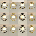 lampe moderne or noir oiseaux dorés branches sphère blanche translucide led echangement facile