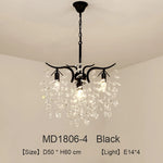 lustre moderne cristal K9 doré noir ampoules LED branches stylisées transparentes salon mariage