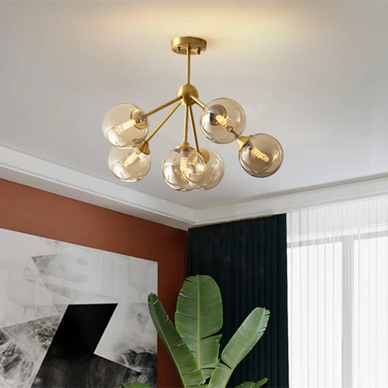 lustre moderne lumières doré sphères transparentes art déco contemporain led chambre salon