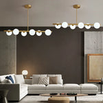 Suspension lumineuse moderne or blanc sphères blanches structure dorée salon chambre