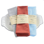 Serviettes de table en coton 100% de la marque Yanting dans différentes couleurs.