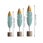 décoration intérieure moderne plumes bois oiseaux décoratifs vert menthe doré table salon