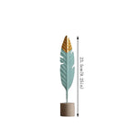 décoration intérieure moderne plumes bois oiseaux décoratifs vert menthe doré table salon