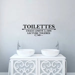 Application autocollant mural toilettes sur mur blanc