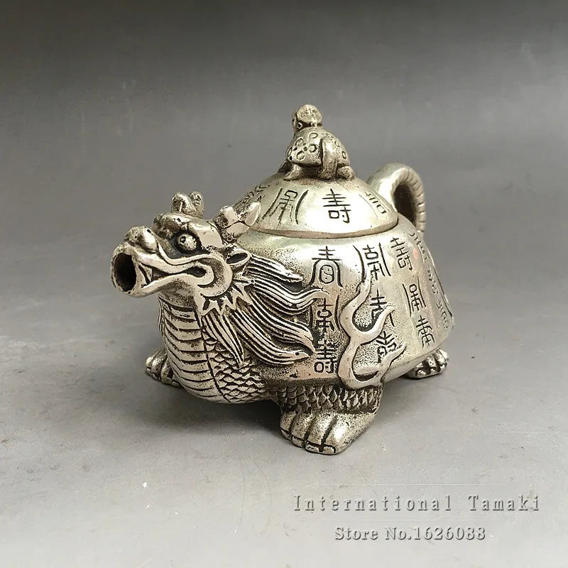théière artisanale argentée dragon motifs floraux lettres chinoises couvercle dragonnette base sculptée