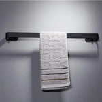 porte serviettes mural moderne vis fixe serviette blanche motifs géométriques rayures noires aluminium noir