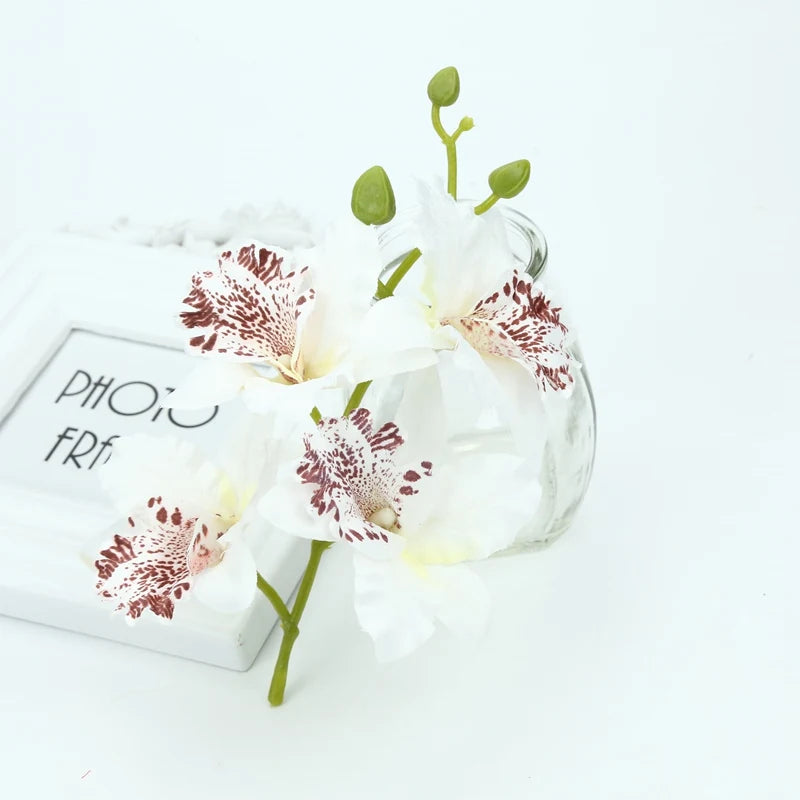 Décoration extérieure mariage bouquet orchidée papillon violet rouge jaune blanc multicolore