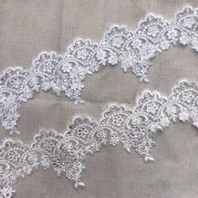 ruban dentelle polyester blanc motifs fleurs ajourés classique romantique festif largeur 13cm opaque erotique