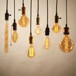ampoules filament spirales dorées transparentes vintage rétro boîtes emballage doublons tringles salon