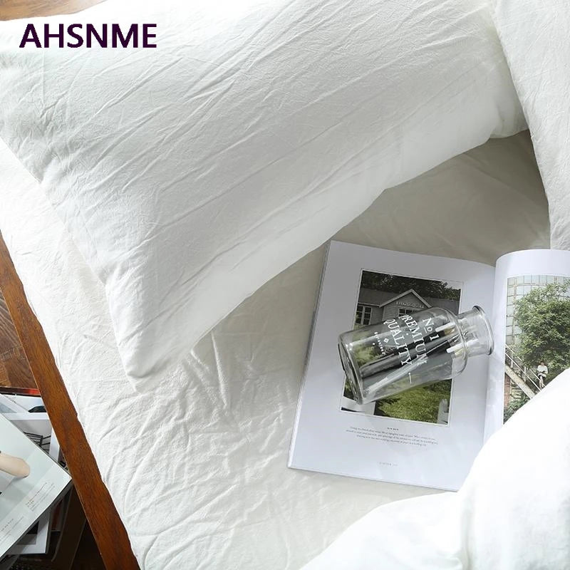 housse couette coton blanc taies oreillers ensemble literie texture minimaliste chambre