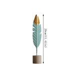 décoration intérieure moderne plumes bois oiseaux décoratifs vert menthe doré table salon