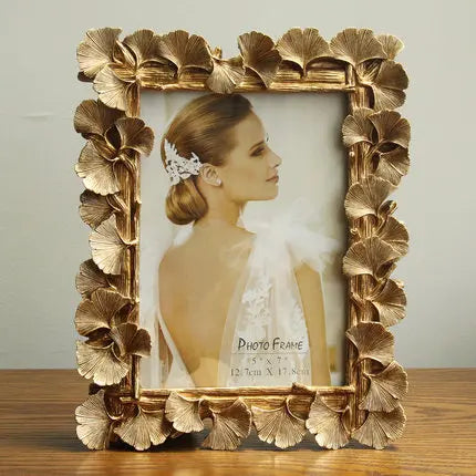 cadre photo ornement feuilles dorées texture métallique vintage fixation photo or antique gold silver
