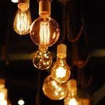 ampoules filament spirales dorées transparentes vintage rétro boîtes emballage doublons tringles salon