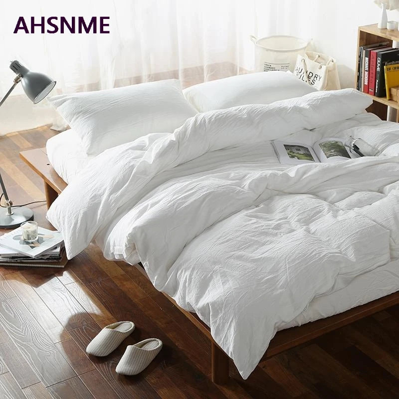 housse couette coton blanc taies oreillers ensemble literie texture minimaliste chambre