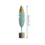 décoration intérieure moderne plumes bois oiseaux décoratifs vert menthe doré table salon