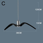 suspension lumineuse moderne oiseau stylisé noir blanc câbles opacité chambre salon