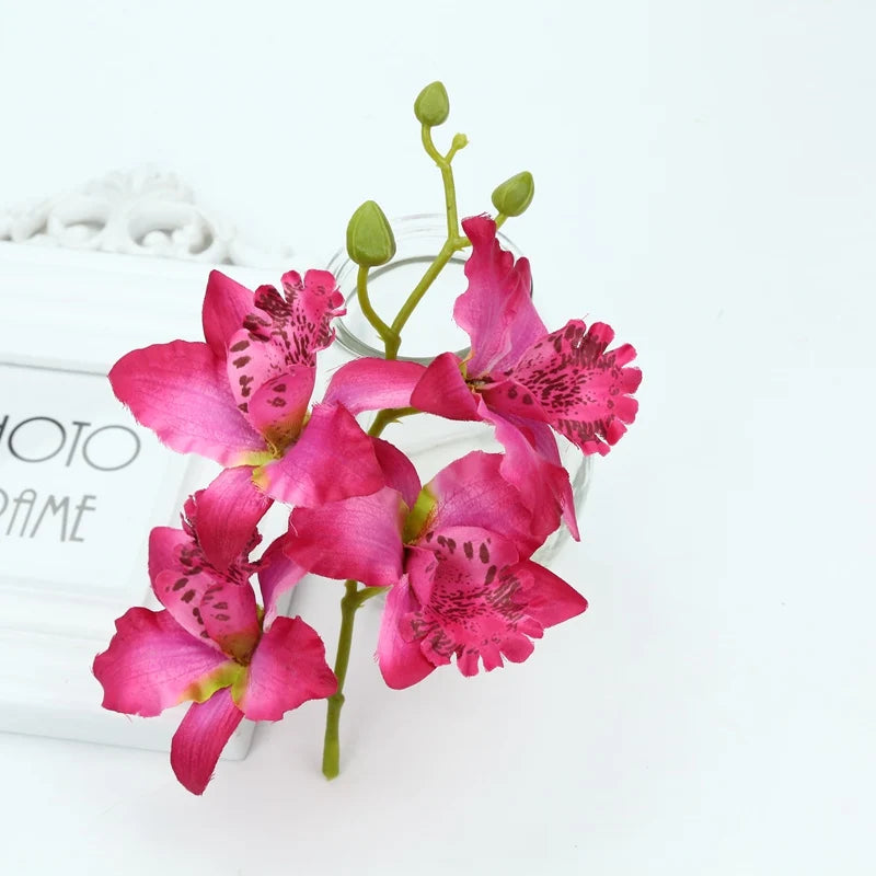 Décoration extérieure mariage bouquet orchidée papillon violet rouge jaune blanc multicolore