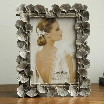 cadre photo ornement feuilles dorées texture métallique vintage fixation photo or antique gold silver