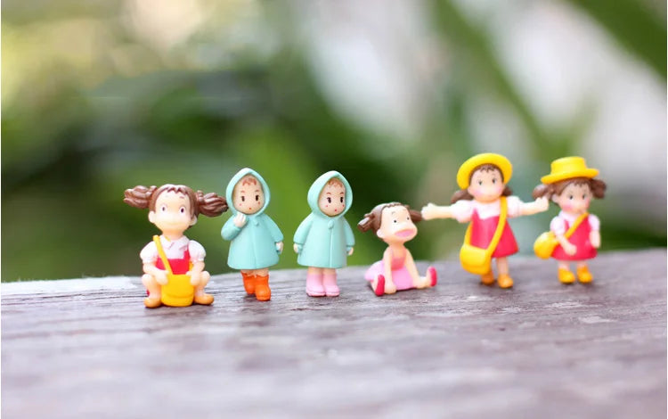 figurines cartoonesques personnes couleurs vives sacs vêtements deco moderne plastique