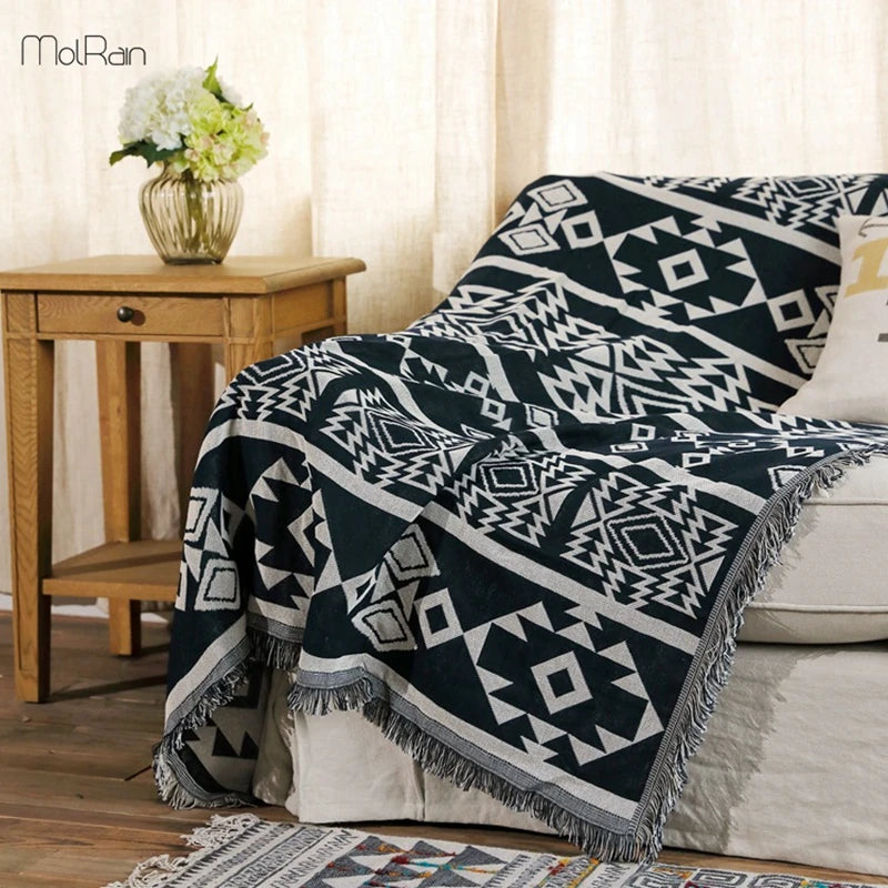 Couverture indienne géométrique bleue sur lit