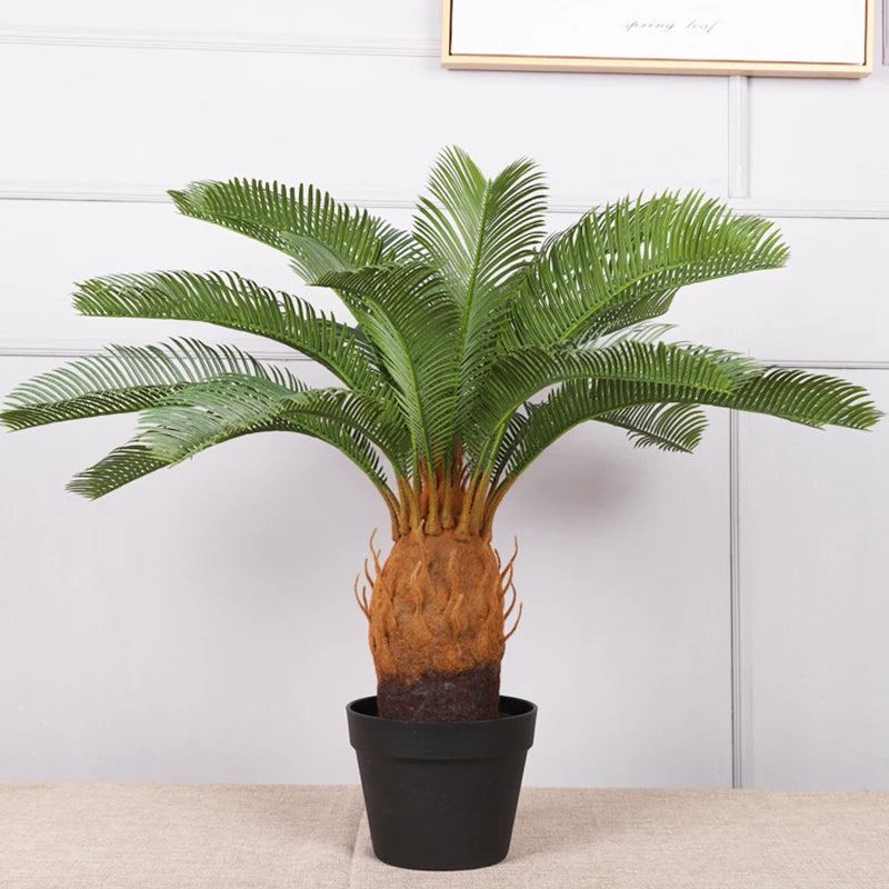 plante artificielle moderne feuilles vertes tronc texturé pot noir décoration intérieure feuilles fines branche