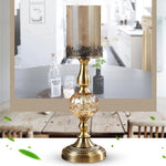 bougeoirs dorés transparents supports bougie colonne texture ornée vintage décoration maison chandelles floraux