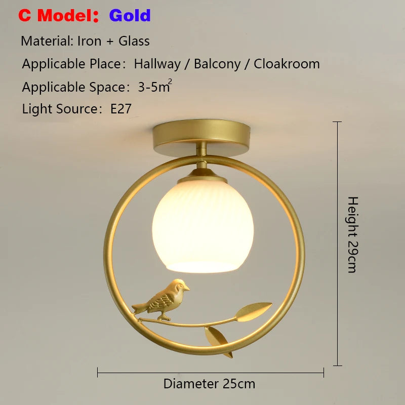 lampe moderne or noir oiseaux dorés branches sphère blanche translucide led echangement facile