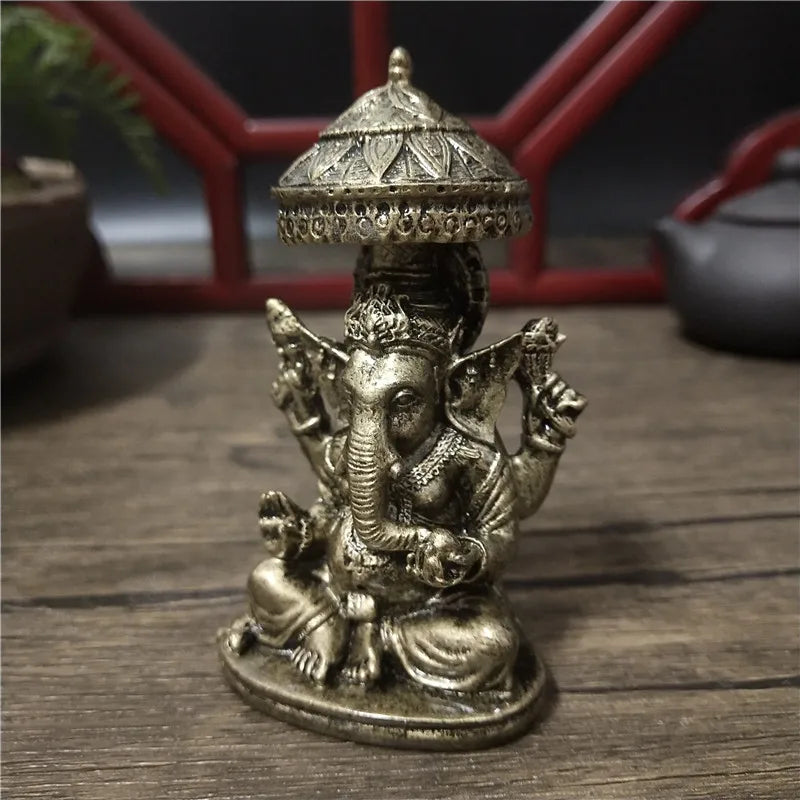statue ganesha dorée résine ornements complexes décoration intérieure artisanale traditionnelle bouddhiste éléphant multiple bras