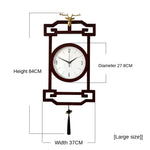 horloge murale bois chinois cadres dorés marron motif géométrique aiguilles dorées classique