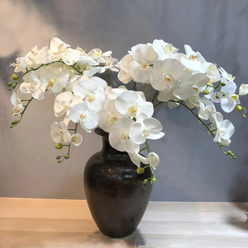 décoration intérieure orchidées artificielles blanc rose jaune feuilles vertes minimaliste mariage anniversaire baby shower