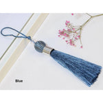 pompons tissu uni polyester noir blanc vert bleu marron doré classiques 23cm total