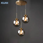 Lampe suspendue en verre gris fumé ambre