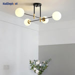 lampe suspension moderne noir doré sphères translucides led restaurant chambre salon