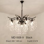 lustre moderne cristal K9 doré noir ampoules LED branches stylisées transparentes salon mariage