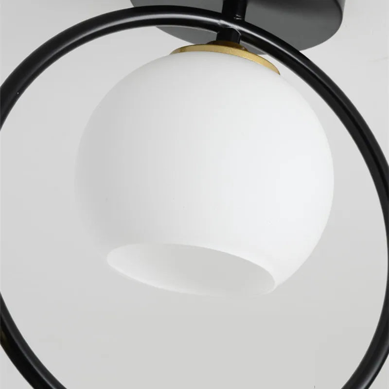 lampe moderne or noir oiseaux dorés branches sphère blanche translucide led echangement facile