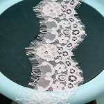 ruban dentelle blanc fleurs motifs géométriques classique polyester nylon maille écologique