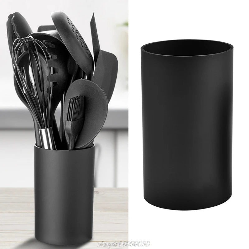 Porte-ustensiles cuisine cylindre noir sur comptoir moderne