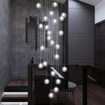 suspension lumineuse moderne verre transparent sphères simples éclairage led contemporain fixations invisibles